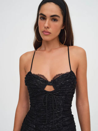 Woman in the For Love and Lemons Bette Mini Lace Dress