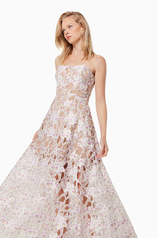 Woman in the Elliatt Connection Maxi Gown in Multi