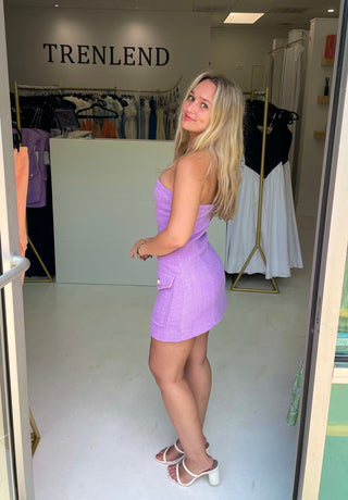 Woman wearing the Ronny Kobo Taren Dress in Lavendar