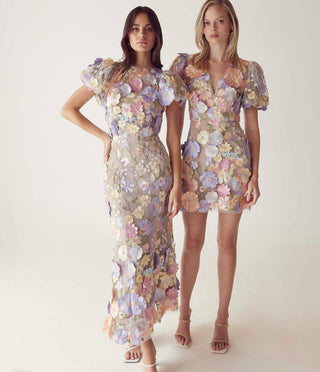 Two women in 3-D floral dresses